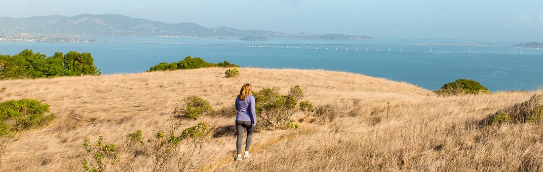 Woman on trail that overlooks the Bay