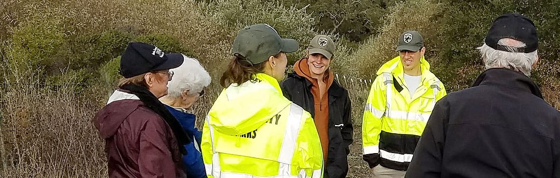 Parks staff out in the field with community members discussing a project