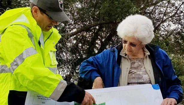 Parks planner reviewing map with Marin resident